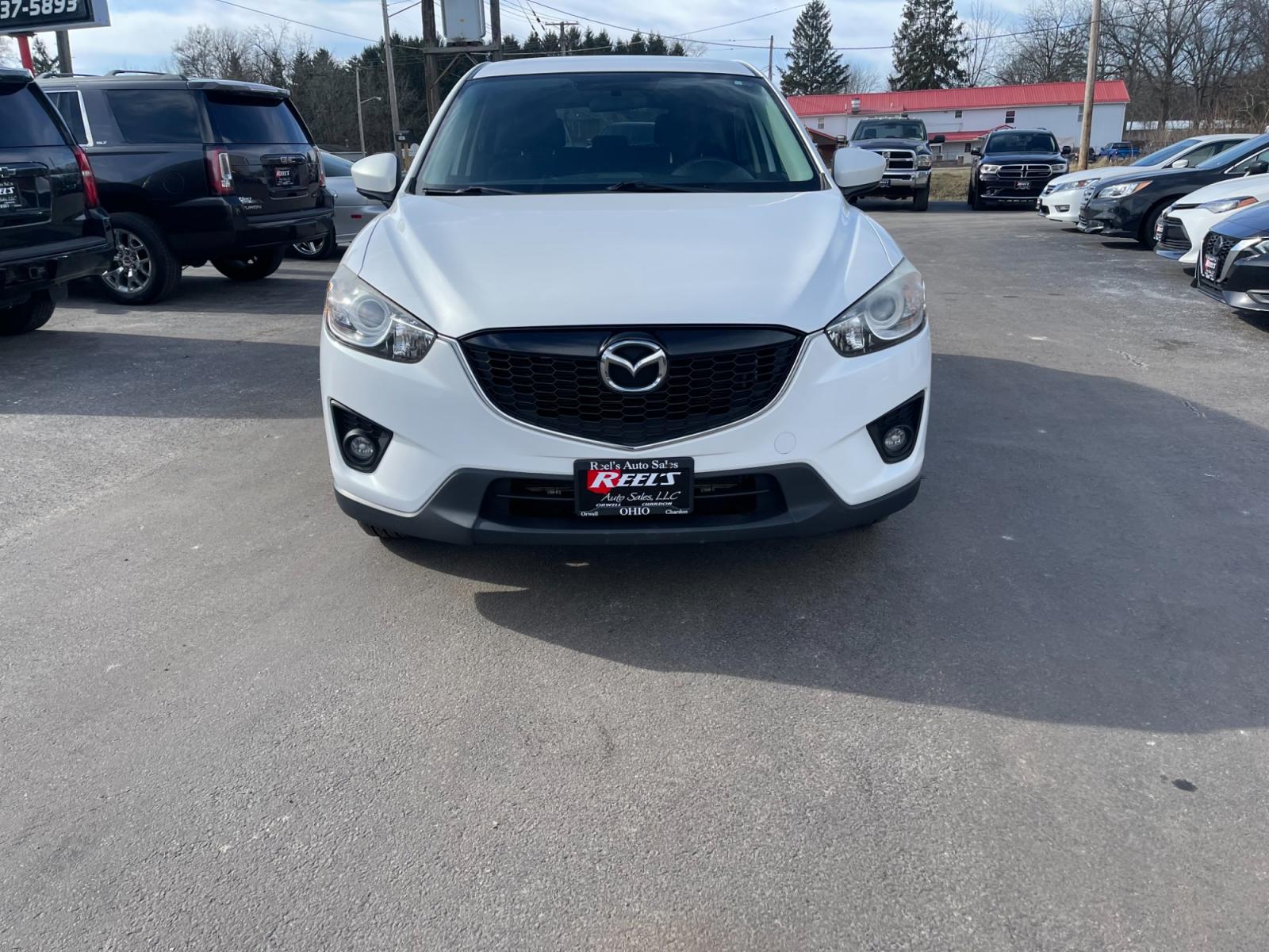 2015 White /Black Mazda CX-5 Touring AWD (JM3KE4CYXF0) with an 2.5L I4 DOHC 16V engine, 6-Speed Automatic transmission, located at 547 E. Main St., Orwell, OH, 44076, (440) 437-5893, 41.535435, -80.847855 - This 2015 Mazda CX-5 Touring AWD is a well-equipped SUV that offers a blend of performance, safety, and convenience for its drivers. Being a one-owner vehicle as per its Carfax report signifies well-attended maintenance and care. It is loaded with advanced features such as Blind Spot Monitoring and - Photo #1